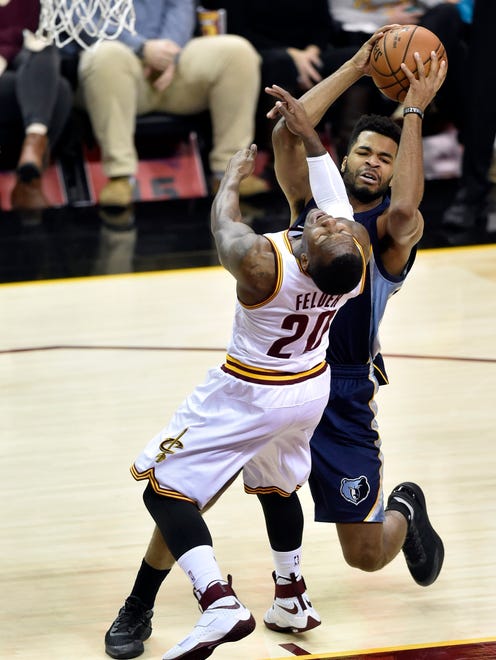 Dec 13, 2016; Cleveland, OH, USA; Memphis Grizzlies guard Andrew Harrison (5) drives to the basket against Cleveland Cavaliers guard Kay Felder (20) in the second quarter at Quicken Loans Arena. Mandatory Credit: David Richard-USA TODAY Sports