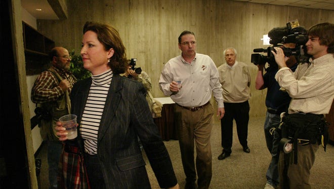 Larry and Stacy Eustachy leave a press conference at Iowa State University on Wednesday, April 30, 2003. The Eustachy's held the press conference to announce that Larry Eustachy had been receiving counseling for a drinking problem and hoped to stay on as head coach for the Iowa State men's basketball team.