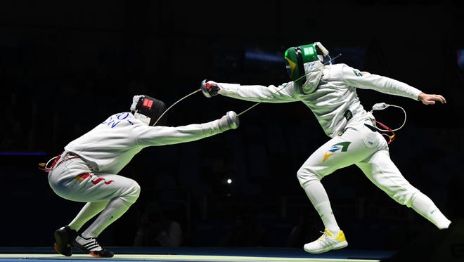 Yunlong Jiao of Chine competes against Guilherme Melaragno of Brazil during the men's epee individual fencing table of 64 in the Rio 2016 Summer Olympic Games at Carioca Arena 3.