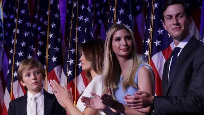 Barron Trump, Melania Trump, Ivanka Trump and Jared Kushner stand on stage and acknowledge the crowd during Donald Trump's election night event at the New York Hilton Midtown in the early morning hours of Nov. 9, 2016.