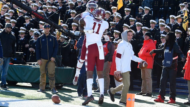 Temple running back Jahad Thomas celebrates with tight end Romond Deloatch (11) after scoring a touchdown against Navy.