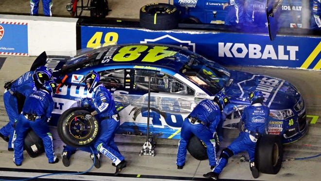 DUEL 2: Jimmie Johnson's Hendrick Motorsports crew works furiously to repair the damage to the No. 48 Chevrolet. Johnson was able to complete all 60 laps.
