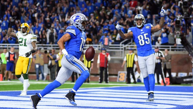 Lions wide receiver Golden Tate (15) scores a touchdown during the second quarter against the Packers.