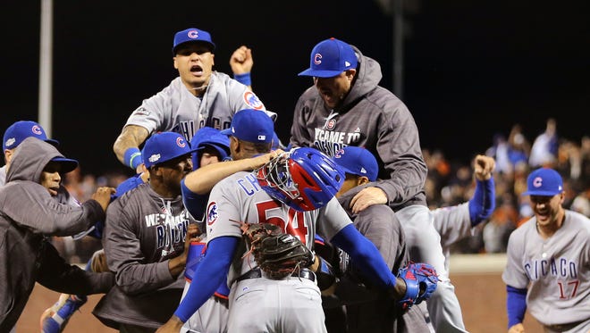 Game 4 in San Francisco: The Cubs celebrate after eliminating the Giants.