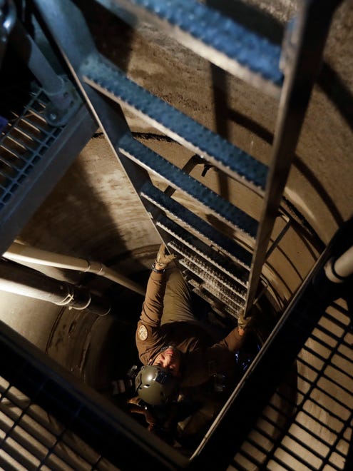 A member of the Border Tunnel Entry Team ascends an entrance carved out by the Border Patrol leading to a tunnel spanning the border between San Diego and Tijuana, Mexico.