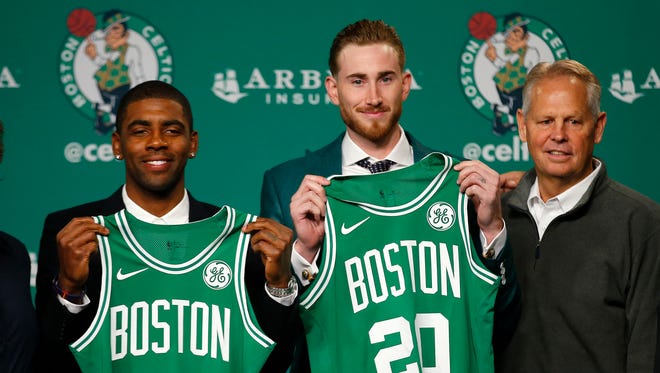 2017: Kyrie Irving and Gordon Hayward pose with their jerseys during their introductory press conference with the Boston Celtics.