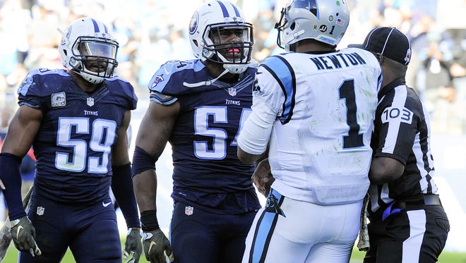 Titans inside linebackers Wesley Woodyard (59) and Avery Williamson (54) take issue with Panthers quarterback Cam Newton's celebration dance after his touchdown during the fourth quarter at Nissan Stadium on Nov. 15, 2015.