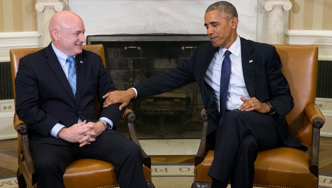 Obama meets with retired NASA astronaut Scott Kelly in the Oval Office on Oct. 21, 2016.