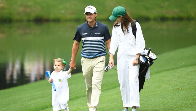 Kevin Kisner walks with daughter Kate and wife Brittany Anne DeJarnett during the Par 3 Contest.
