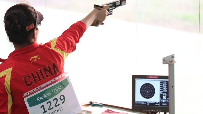 Jingjing Zhang of China prepares to shoot during the women's 25-meter pistol precision qualification shooting event in the Rio 2016 Rio Olympic Games at Olympic Shooting Centre.