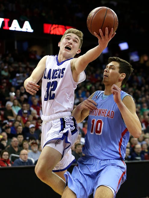 Brookfield Central's Gage Malensek (left) drives past Arrowhead's Alec Hamilton for a score.