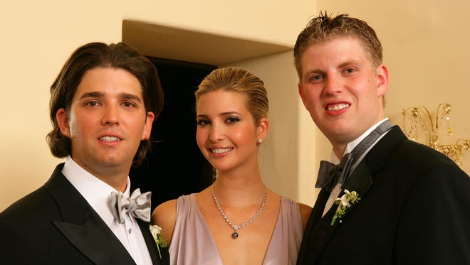 Back in the day... Donald Trump Jr., left, poses with Ivanka and Eric after his wedding ceremony at the Mar-a-Lago Club Nov. 12, 2005 in Palm Beach, Fla.