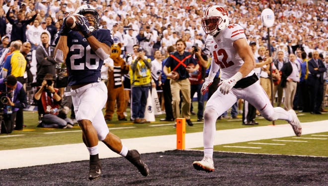 Penn State running back Saquon Barkley (26) catches a touchdown against Wisconsin.