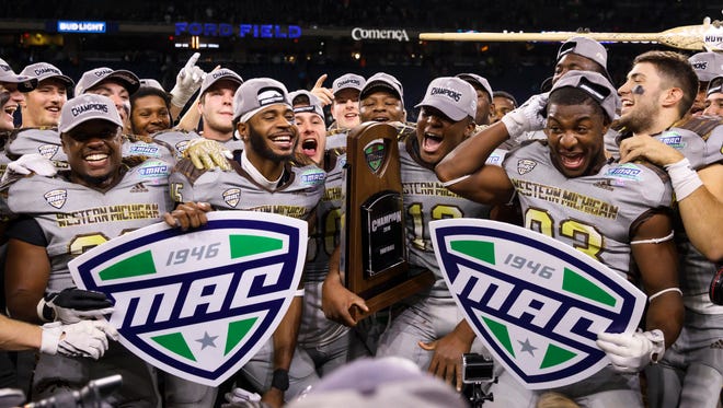 Western Michigan celebrates after defeating Ohio to win its first MAC title since 1988.
