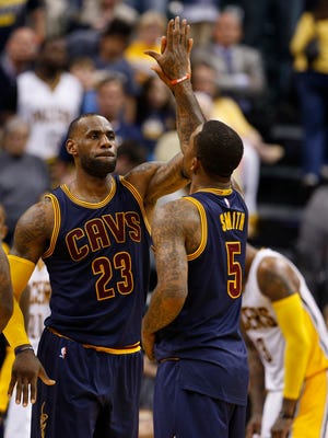 Cleveland Cavaliers forward LeBron James (23) is congratulated by guard J.R. Smith (5) after scoring against the Indiana Pacers in game four of the first round of the 2017 NBA Playoffs at Bankers Life Fieldhouse.