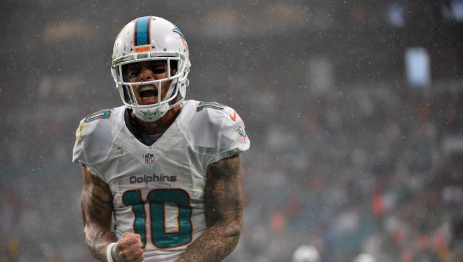 Miami Dolphins wide receiver Kenny Stills (10) celebrates after making a catch in the game against the Arizona Cardinals during the second half at Hard Rock Stadium.