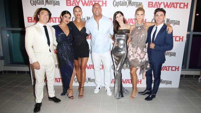 The cast of the new 'Baywatch': Jon Bass (from left), Priyanka Chopra, Ilfenesh Hadera, Dwayne Johnson, Alexandra Daddario, Kelly Rohrbach and Zac Efron.