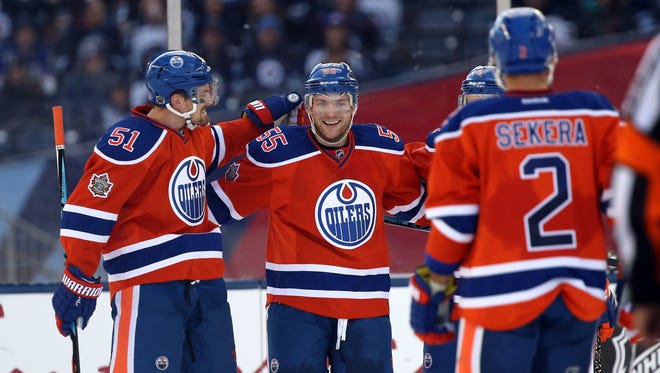 Oilers forward Mark Letestu (55) celebrates with teammates after scoring against the Jets.