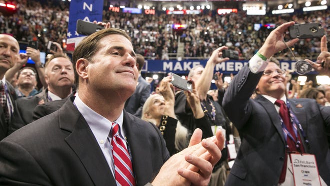 Gov. Doug Ducey cheers the nomination of Donald Trump at the Republican National Convention