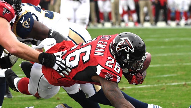 Falcons running back Tevin Coleman (26) rushes for a touchdown against the Rams.