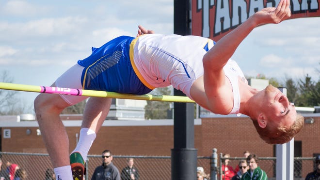 Zach Dybul of Mukwonago clears the bar at 6 feet 5 inches to win the boys high jump.