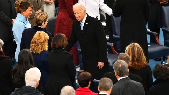 Vice President Biden greets Melania Trump and Baron Trump as he arrives the 2017 Presidential Inauguration.