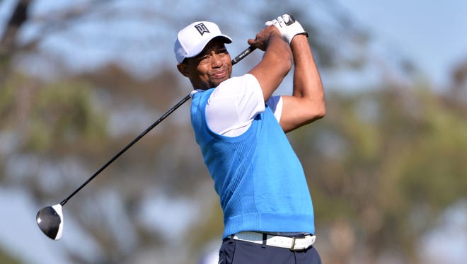 Tiger Woods tees off the 5th hole during the first round of the Farmers Insurance Open at Torrey Pines in San Diego on Jan. 27,