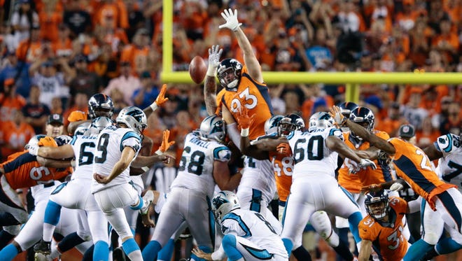 Carolina kicker Graham Gano's potential winning field goal sails wide as the Broncos edged the Panthers.