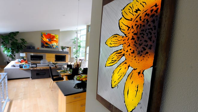 A metal, wood and painted flower greets visitors as they enter the home.