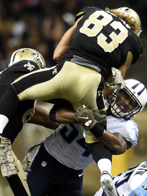 Titans inside linebacker Avery Williamson (54) stops Saints wide receiver Willie Snead (83) during the fourth quarter in New Orleans on Nov. 8, 2015.