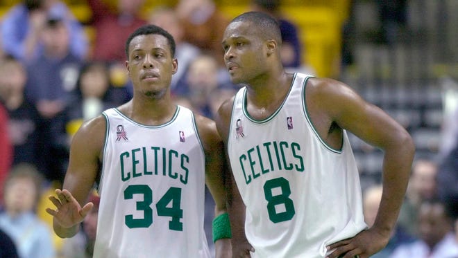2001: Paul Pierce and Antoine Walker talk during the final seconds of their 104-98 win against the Cleveland Cavaliers.
