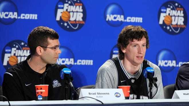 Butler Bulldogs head coach Brad Stevens listens to player Matt Howard as he answers questions on Sunday, April 3, 2011 while addressing the media about their preparation for the NCAA Men's Championship Game against the Connecticut Huskies at Reliant Stadium in Houston, Texas on Monday, April 4, 2011. (Matt Detrich / The Star)