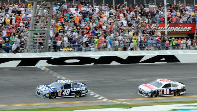 Jimmie Johnson crosses the finish line to win the 2013 Daytona 500.