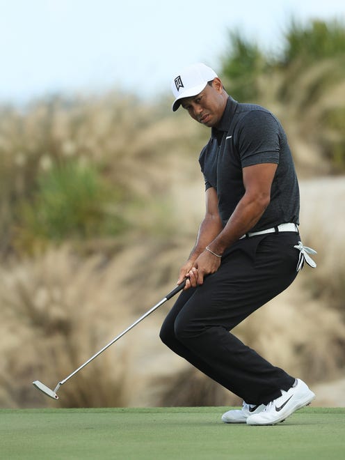 Tiger Woods misses a birdie putt on No. 2Friday  in the first round  of the Hero World Challenge in Nassau, Bahamas.  (Photo by Mike