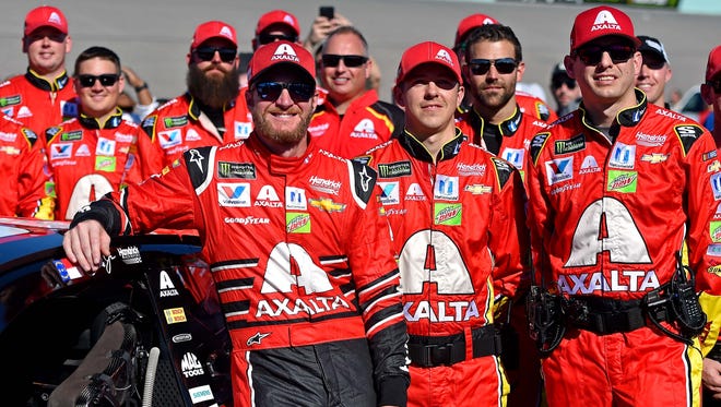 Dale Earnhardt Jr. (88) poses for a picture with his team before the Ford EcoBoost 400 at Homestead-Miami Speedway, his final full-time race.