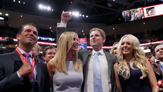Donald Trump, Jr., Ivanka Trump, Eric Trump and Tiffany Trump celebrate on the convention floor during the second day of the Republican National Convention on July 19, 2016, in Cleveland.