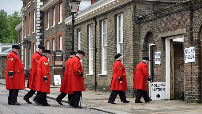 Chelsea pensioners enter a polling station to vote in the EU Referendum in London. Britons voted on whether to remain in or leave the European Union in a referendum on 23 June.
