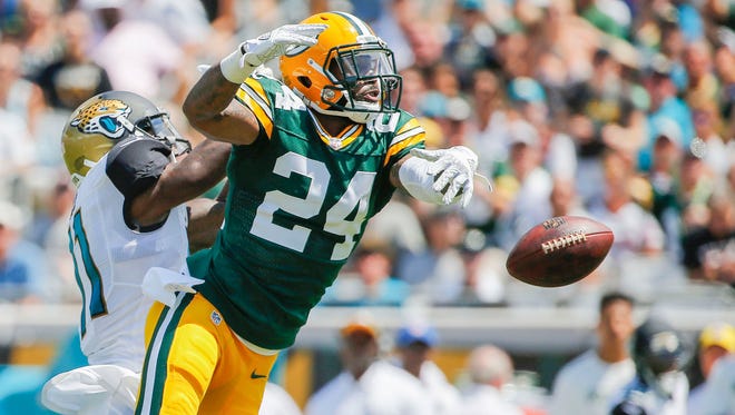 Green Bay Packers cornerback Quinten Rollins (24) breaks up Jacksonville Jaguars wide receiver Marqise Lee (11) pass during the first quarter at EverBank Field.