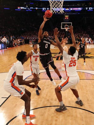 South Carolina Gamecocks guard Sindarius Thornwell (0) shoots the ball against Florida Gators forward Keith Stone (25) during the second half in the finals of the East Regional of the 2017 NCAA Tournament at Madison Square Garden.