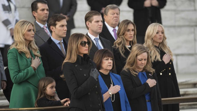 Family members watch as President-elect Trump and Vice President-elect Pence take part in a wreath-laying ceremony at Arlington National Cemetery.