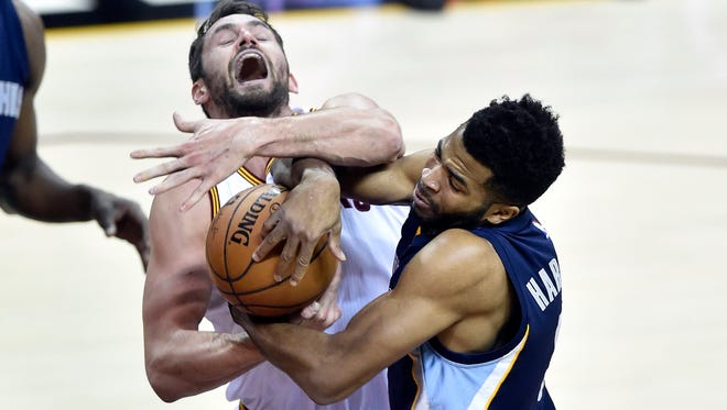 Dec 13, 2016; Cleveland, OH, USA; Cleveland Cavaliers forward Kevin Love (0) and Memphis Grizzlies guard Andrew Harrison (5) reach for the ball in the first quarter at Quicken Loans Arena. Mandatory Credit: David Richard-USA TODAY Sports