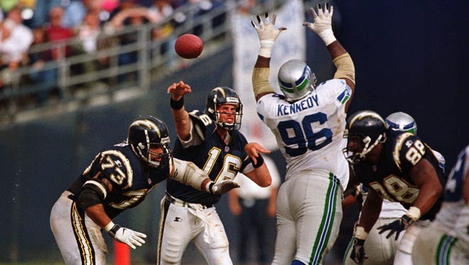 Cortez Kennedy gets his hands up to knock down a pass by San Diego Chargers quarterback Ryan Leaf during a 27-20 Seahawks win in 1998.