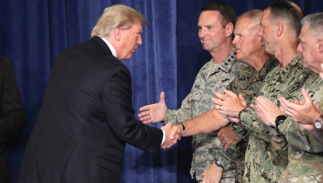 President Trump greets military leaders on Aug. 21, 2017.