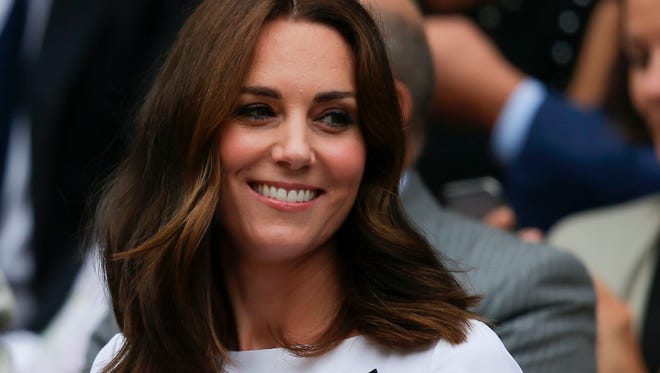 Kate Middleton, Duchess of Cambridge, sits in the Royal box on Centre Court for the men's singles final match.