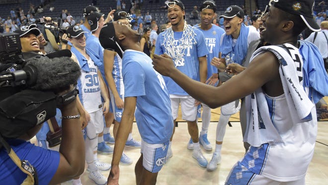The North Carolina Tar Heels celebrate after defeating the Kentucky Wildcats in the finals of the South Regional of the 2017 NCAA Tournament at FedExForum. North Carolina won 75-73.