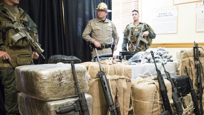 At a press conference, Arizona Governor Doug Ducey talks about confiscated drugs from the Arizona border, after he address a need of federal help to stop narcotics trafficking at Arizona State Capitol on Nov. 23, 2015.
