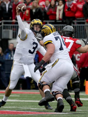 Michigan Wolverines quarterback Wilton Speight throws downfield during the first half against Ohio State at Ohio Stadium on Saturday, Nov. 26, 2016.