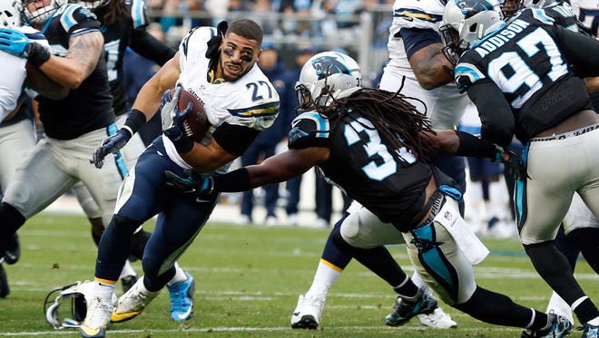 San Diego Chargers running back Kenneth Farrow (27) runs after losing his helmet in the third quarter against the Carolina Panthers at Bank of America Stadium.