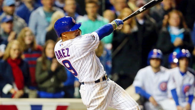 Game 1 in Chicago: Cubs second baseman Javier Baez hits a a home run in the eighth inning.
