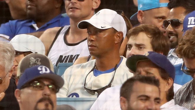 Tiger Woods attends Game 2 of the 2017 World Series between the Houston Astros and the Los Angeles Dodgers at Dodger Stadium on Oct. 25.